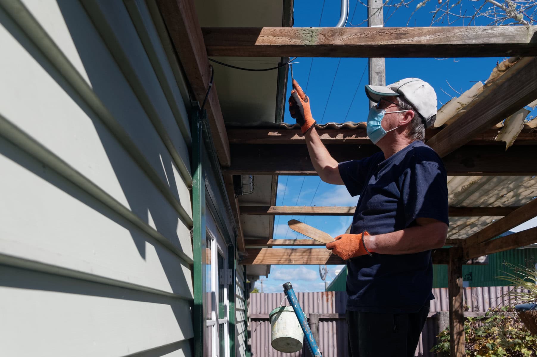 man preparing house exterior